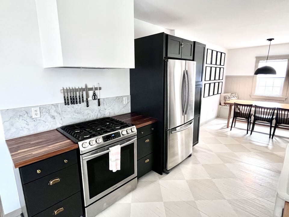 Modern fully stocked kitchen with stove, microwave, dishwasher and fridge/freeze