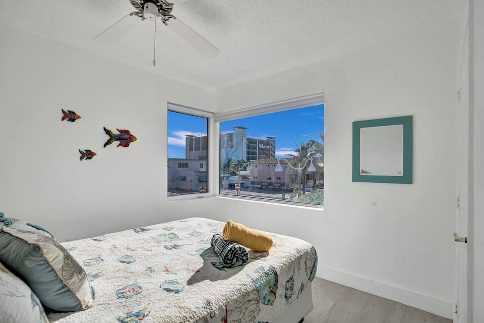 Comfortable Bedroom with Ocean and Neighborhood Views