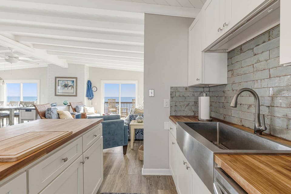 Spacious kitchen counter for meal preparation.