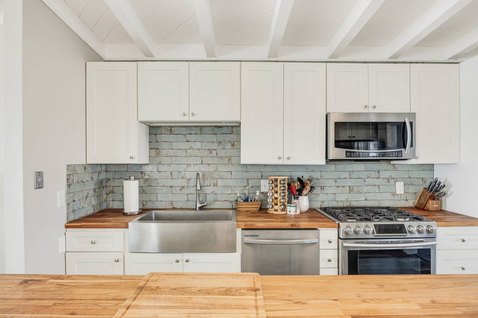 Spacious kitchen counter for meal preparation.