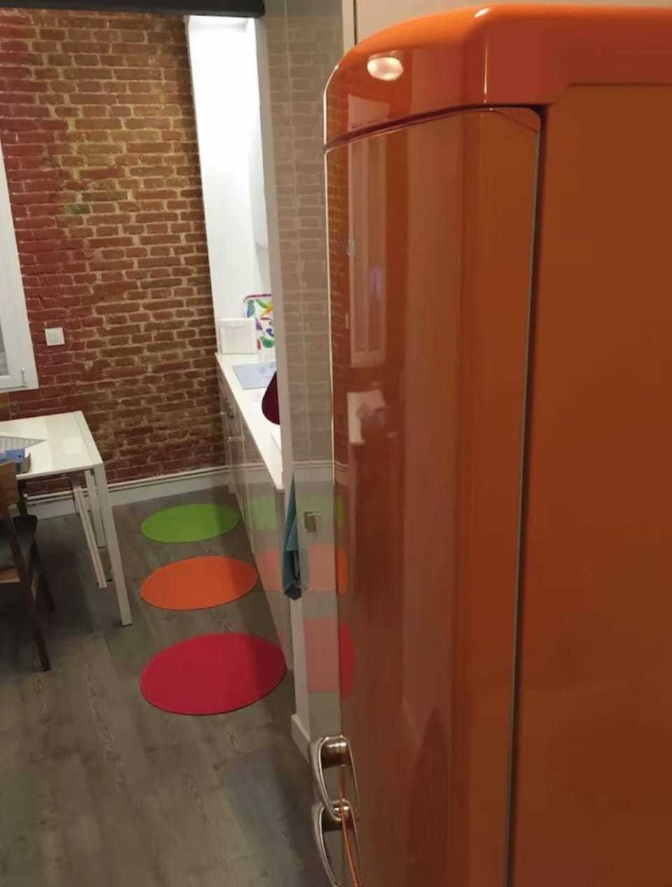 Looking from the hallway into the kitchen area