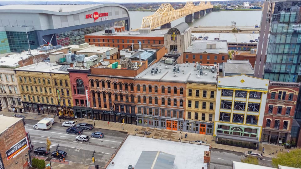 Exterior: Stay steps from the KFC Yum! Center, Whiskey Row, and more in this spacious downtown apartment—perfect for groups exploring Louisville’s best spots!