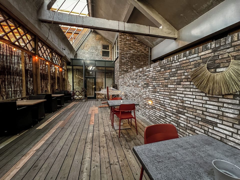 Rustic charm meets modern design in this stunning space—ideal for meetings, coffee, or quiet moments.