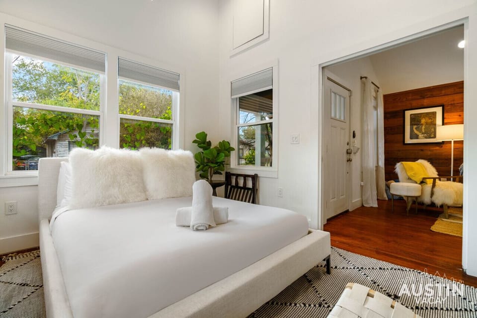 This bedroom/work space provides a pocket door for privacy