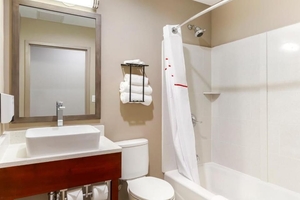 Refresh with a bright vanity and a clean tub-shower.
