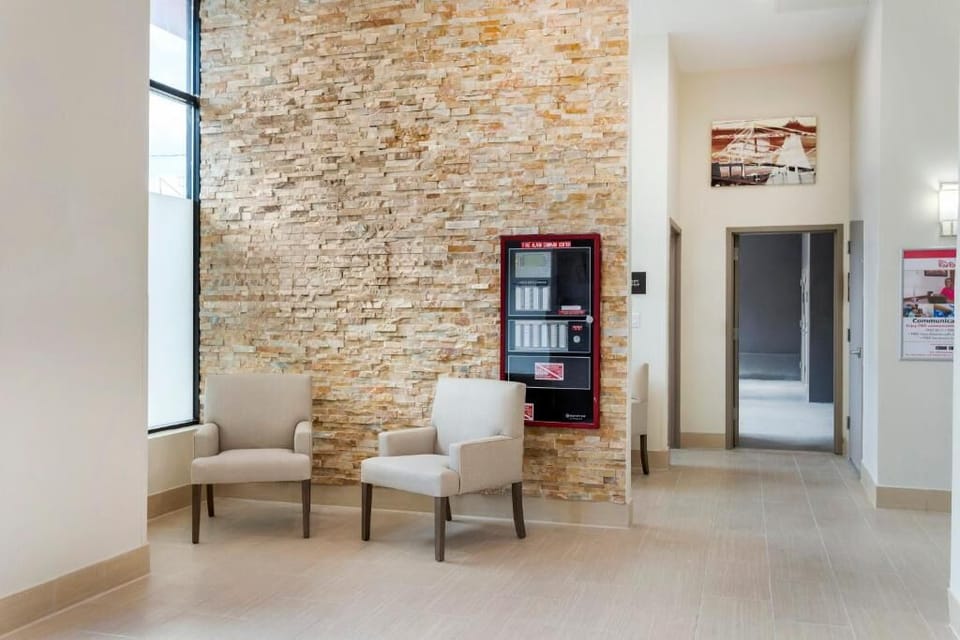 Relax for a moment in a calm, sunlit lobby nook.