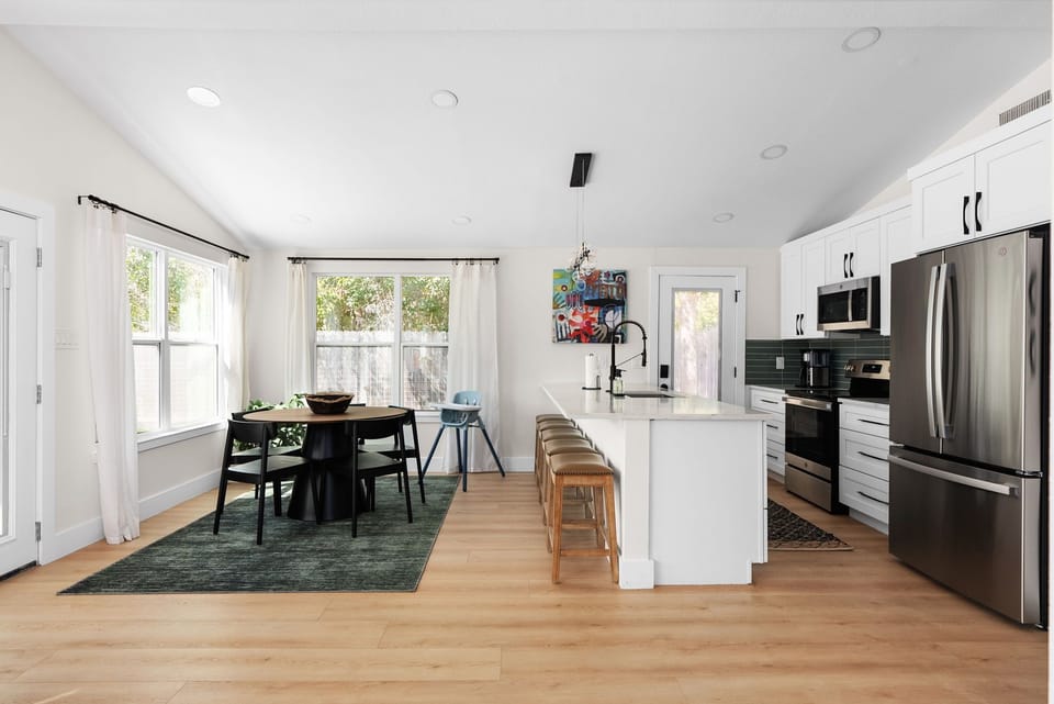 Gather 'round! 🍽️✨ Our cozy kitchen is all about connection—with a charming table for 4, an extra dash of seating at the island, and even a high chair for the little ones! 