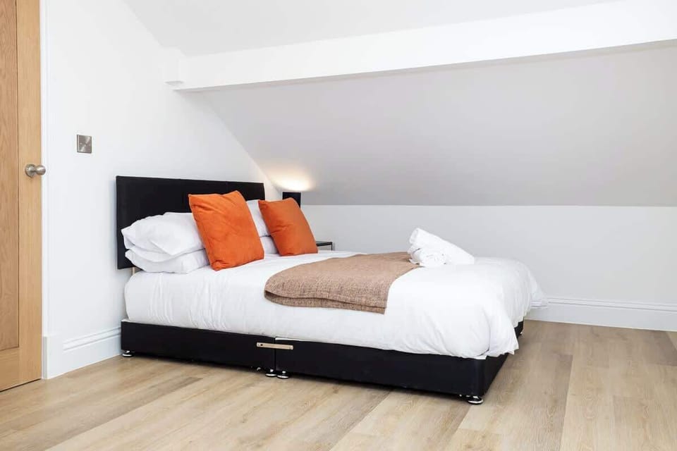 The bedroom benefits from a luxury en-suite bathroom and a comfy king-size bed.