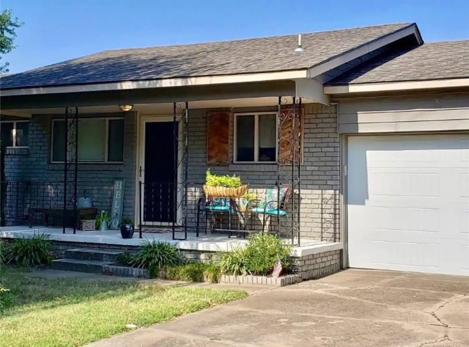 Front of home with covered porch - great space to have a morning coffee.