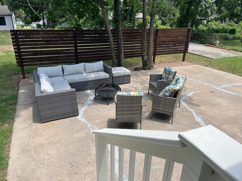 Outside sitting area with a fire pit and grill available