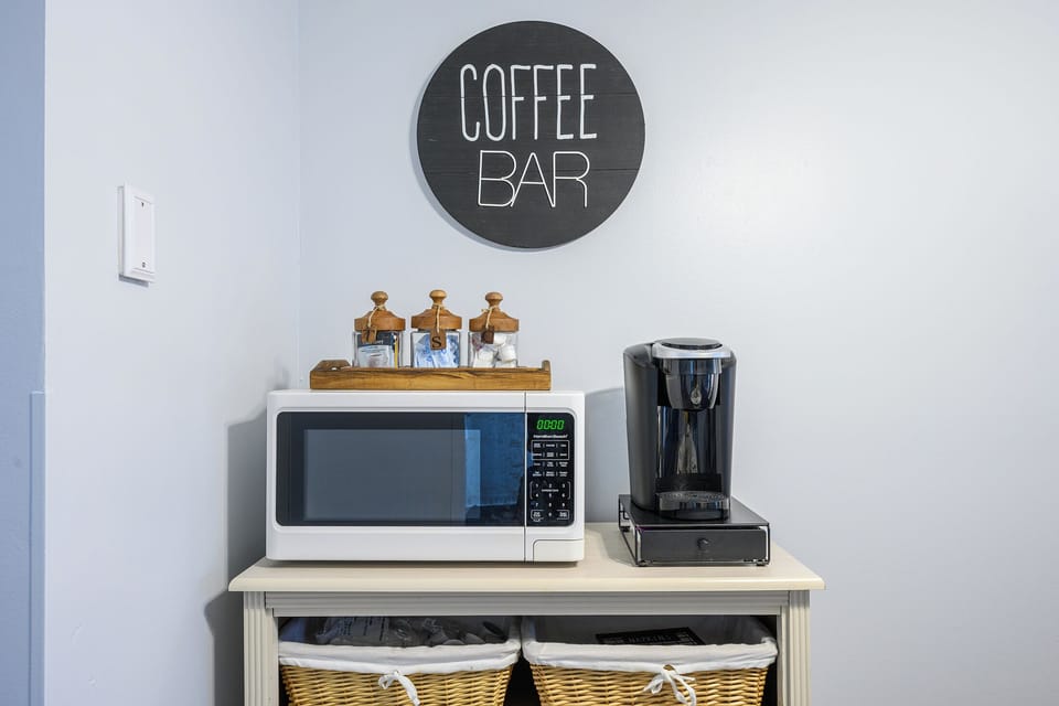 Start your mornings right at the coffee station, stocked with coffee, tea, and all the essentials for a cozy and convenient start to your day.