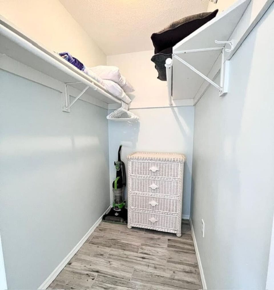 Closet with Linens, Vacuum and Dresser