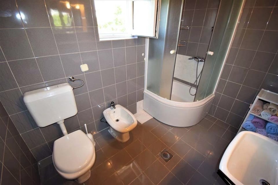 Clean bathroom with shower and amenities.