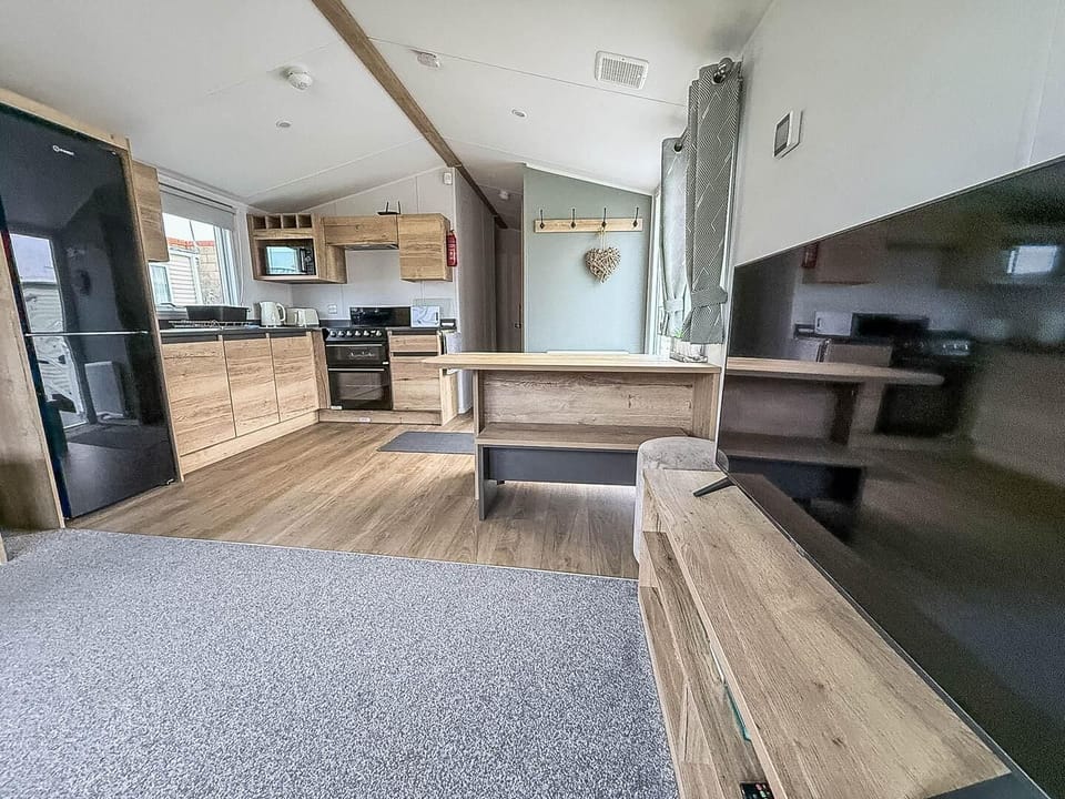 Spacious open-concept living and kitchen area with modern finishes