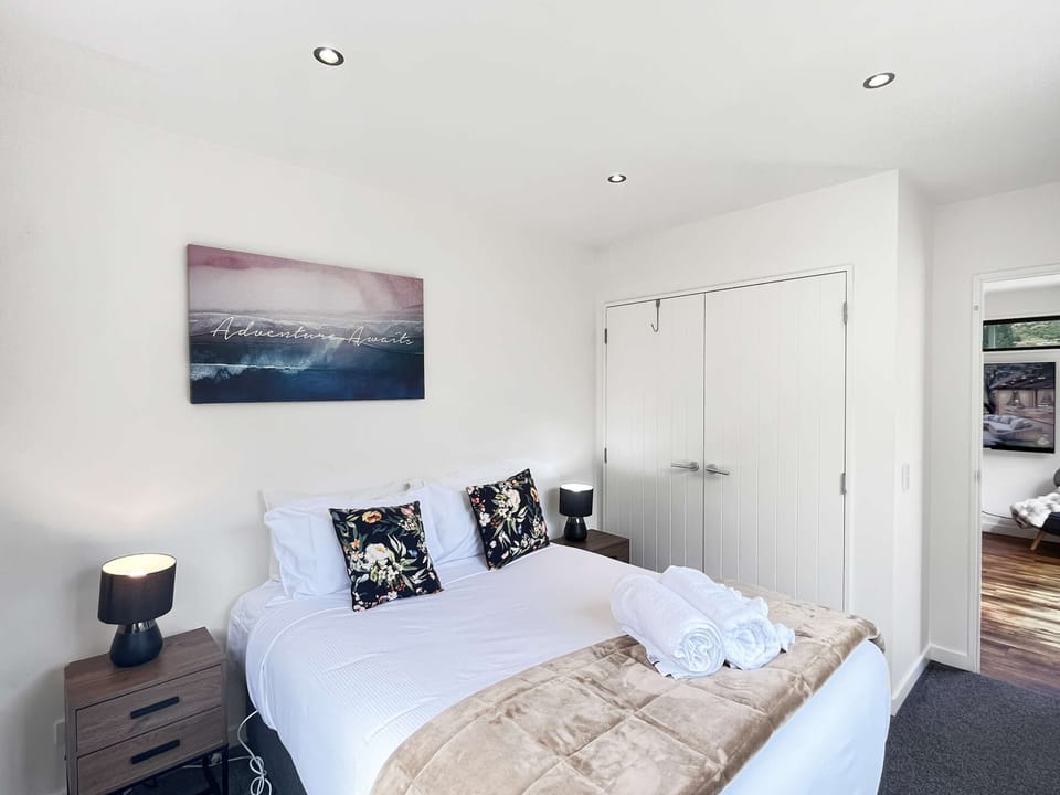 Calm bedroom with crisp linen and soft lighting