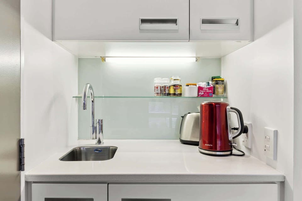 Compact kitchenette with kettle, toaster, and essentials