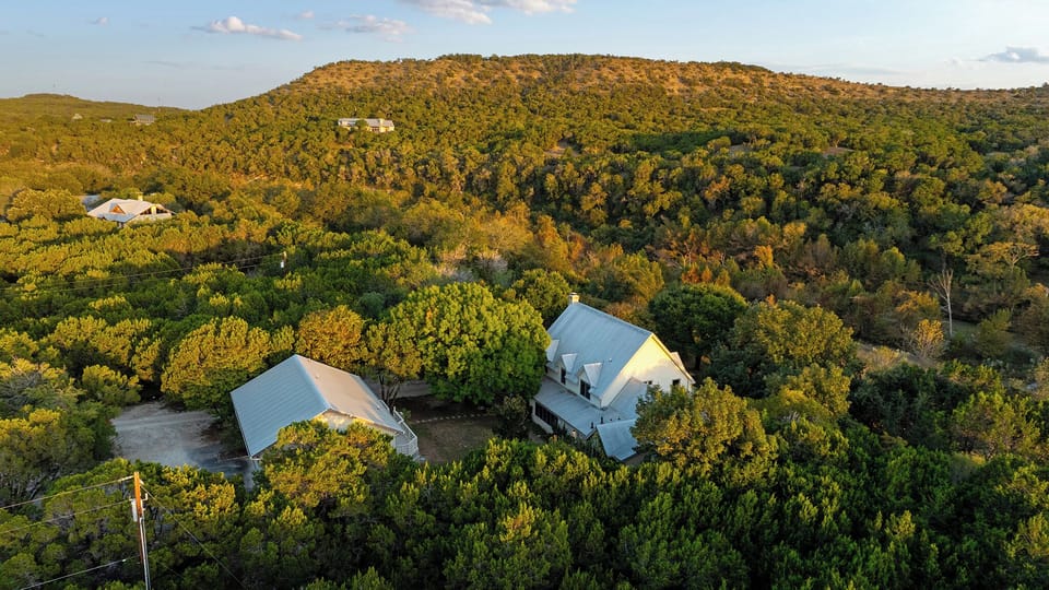 Nestled on a peaceful 5-acre estate, this riverside retreat with 2 separate units offers a perfect blend of luxury and nature, inviting you to relax and unwind with your large group of family and friends for connection and rejuvenation.