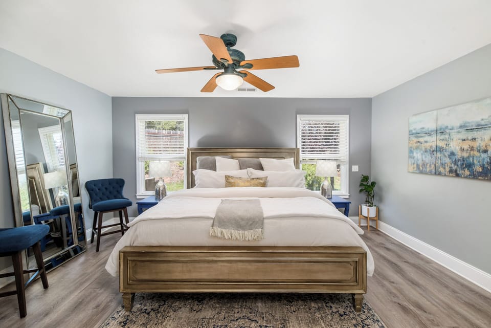 King primary suite with soaking tub — a quiet retreat for couples or wedding hos
