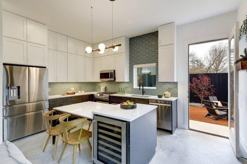 Chef's kitchen with wine fridge and cooking essentials