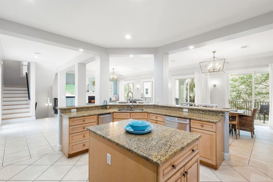 Your spacious gourmet kitchen features granite countertops and a large island, perfect for preparing meals while enjoying conversations with family.
