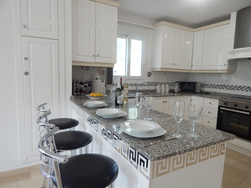 Open plan kitchen with breakfast bar