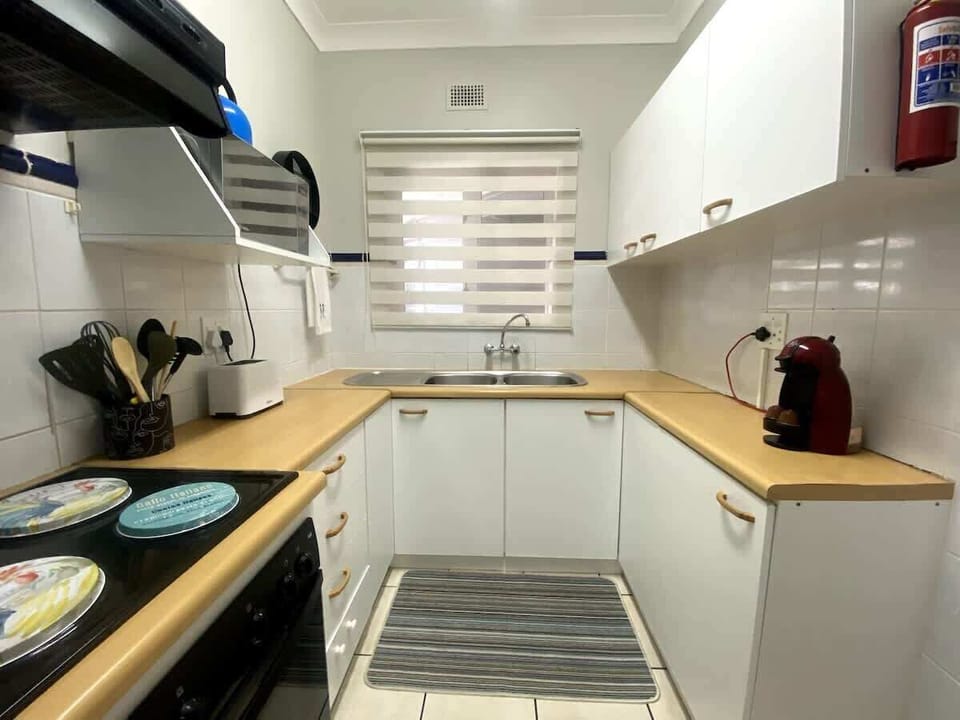 Small but fully equipped kitchen. There is an oven / stove combo with a small 1 plate gas stove for loadshedding times. A kettle, toaster, microwave and a coffee machine: all at your disposal. 