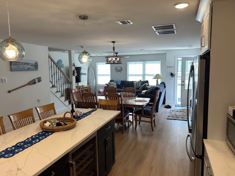 kitchen flows into dining room, then living room..