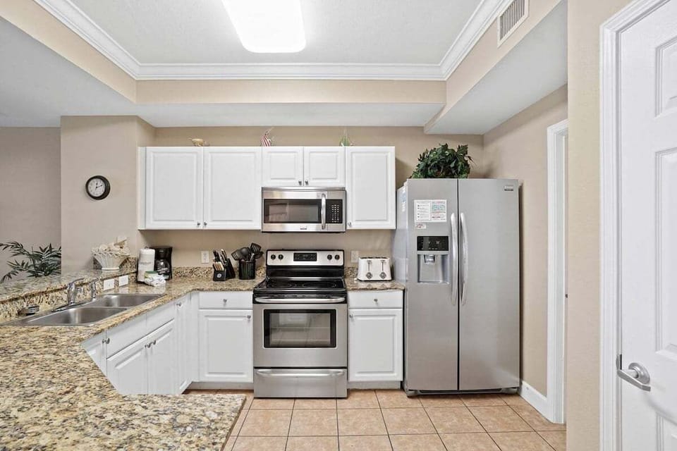 Full kitchen with stainless appliances and all cooking essentials