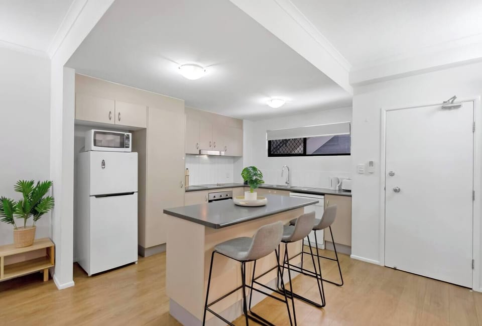 The kitchen comes with everything you’ll need to prepare meals at home, with a breakfast bar for slow mornings.