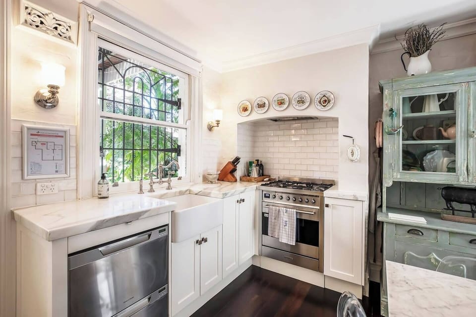 Cook with ease in the modern, fully equipped kitchen featuring a convenient butler’s pantry.
