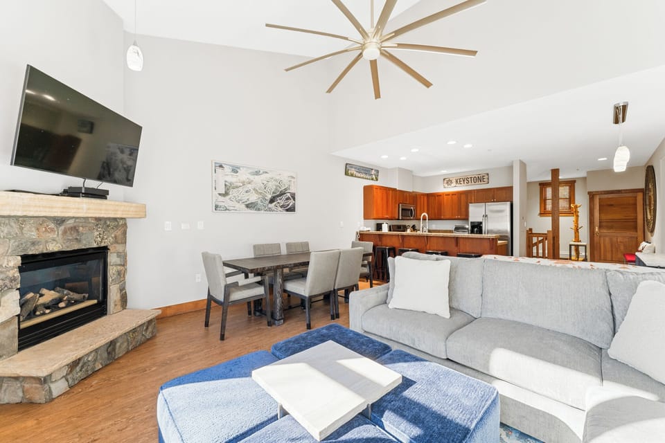 Your spacious living area flows seamlessly from cozy fireplace to modern kitchen, perfect for gathering with friends and family.