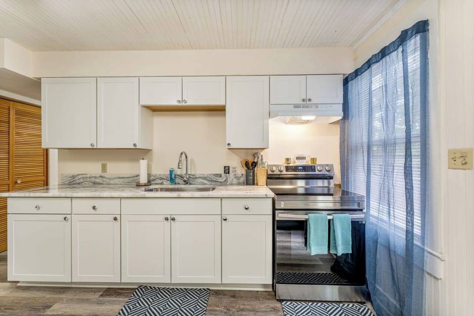Enjoy culinary comforts in a well-equipped kitchen for your extended stay.