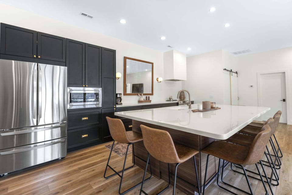 The gorgeous, updated kitchen offers ample space & all the comforts of home