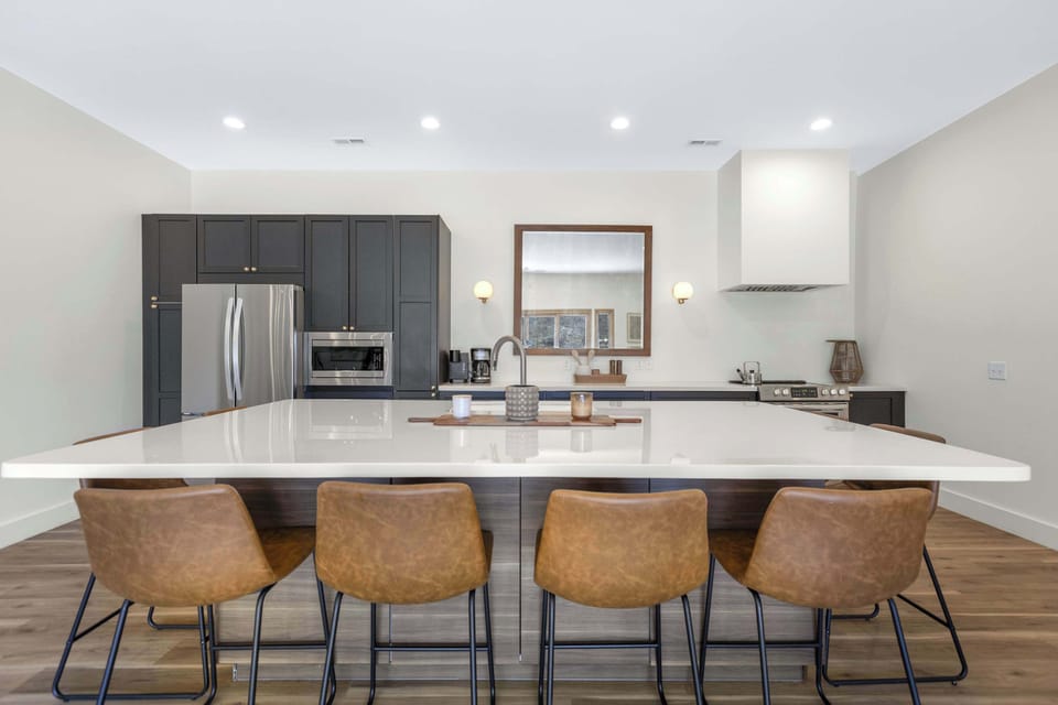 The gorgeous, updated kitchen offers ample space & all the comforts of home