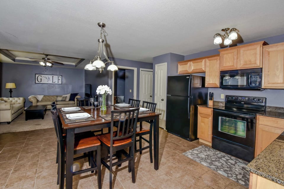 The chic eat-in kitchen offers ample space & all the comforts of home