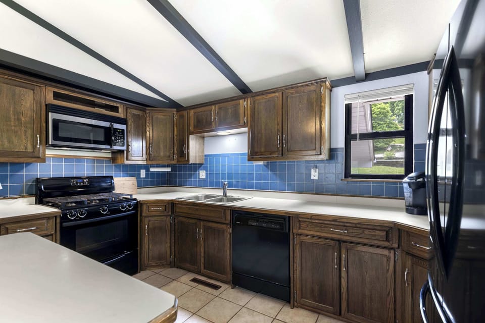 The open kitchen offers ample space & all the comforts of home