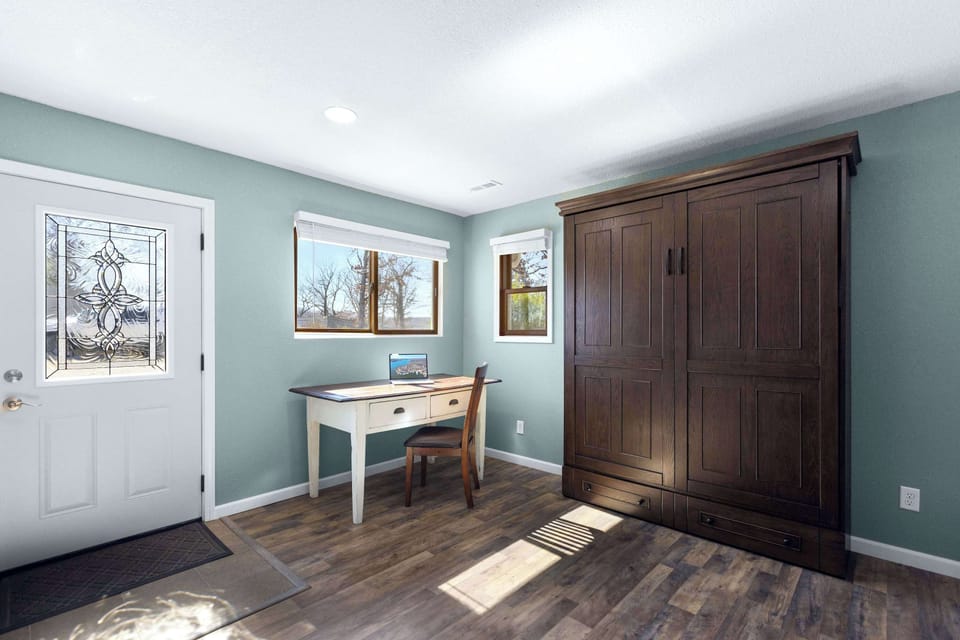 The spacious room can be utilized as an office or as additional sleeping with the queen murphy bed