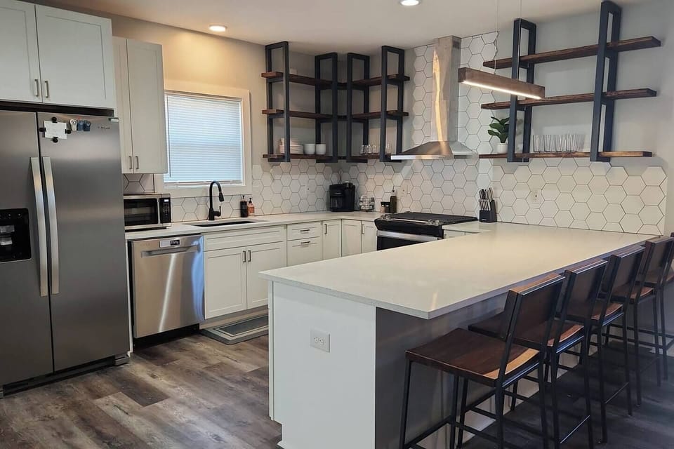 Communal space - kitchen - large open shelving and amble storage