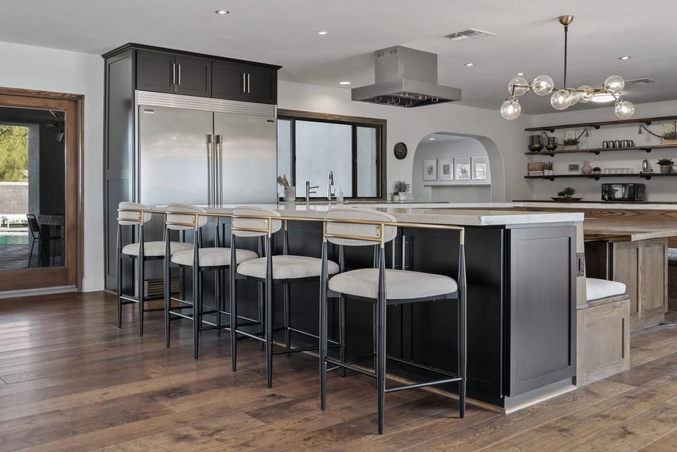 Dining and kitchen area with booth-style seating and full culinary amenities