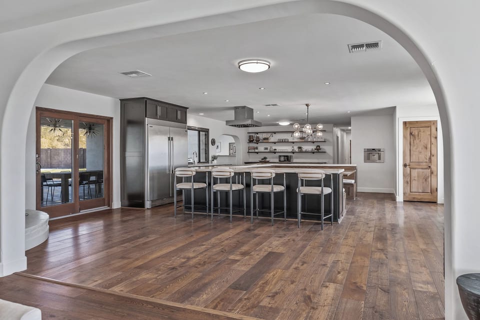 Dining and kitchen area with booth-style seating and full culinary amenities
