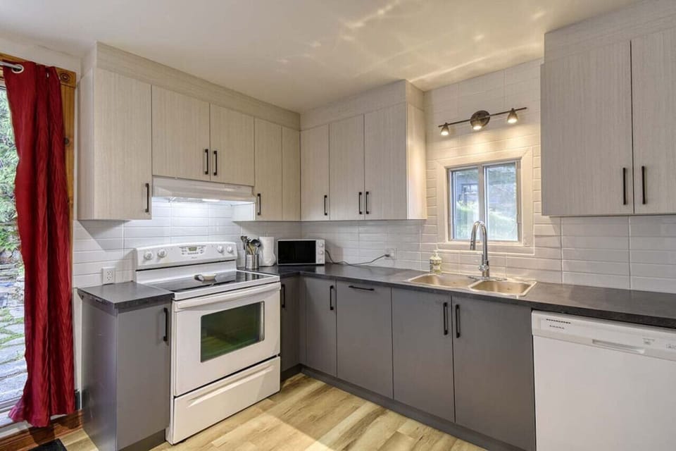 Stylish white and grey themed kitchen—offering a bright, modern space for cooking and entertaining.