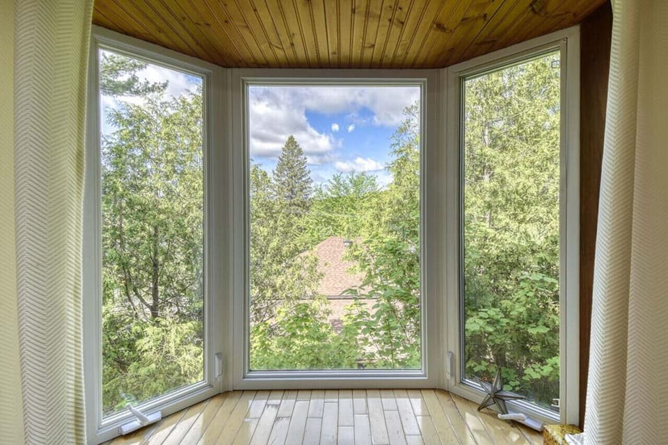 Large window showcasing a beautiful nature view—bringing the outdoors in for a calming ambiance.