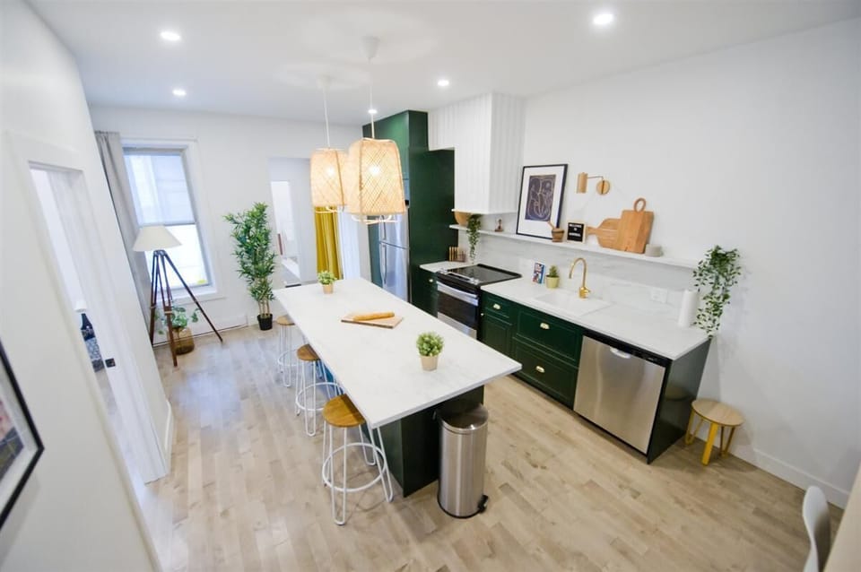 Spacious designer kitchen with a large island, ideal for cooking, dining, and gathering.