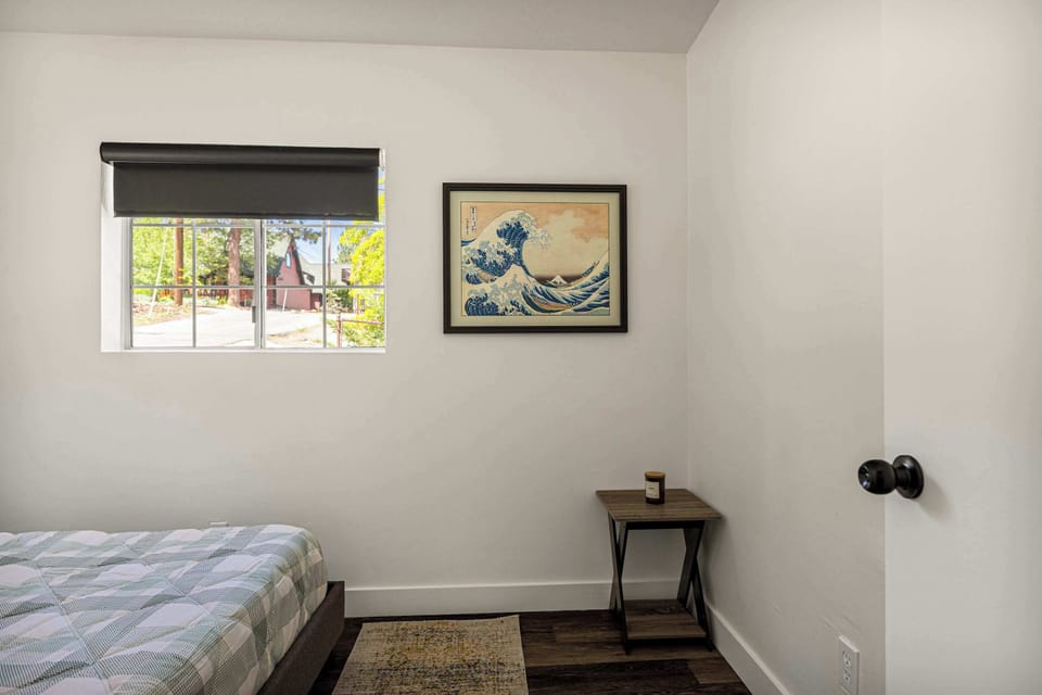 Bright and cheery bedroom with queen bed