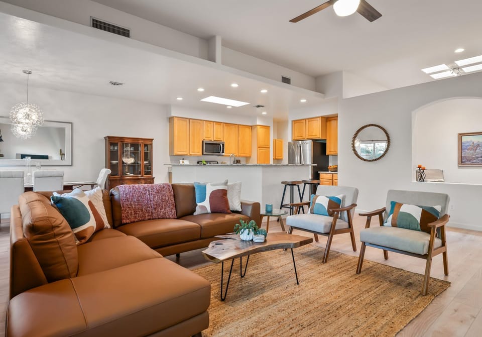 Open concept kitchen flows seamlessly between adjacent living & dining spaces