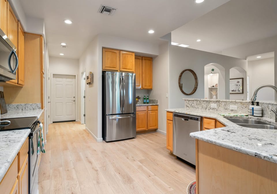 Quality appliances & granite counters compliment this open concept kitchen