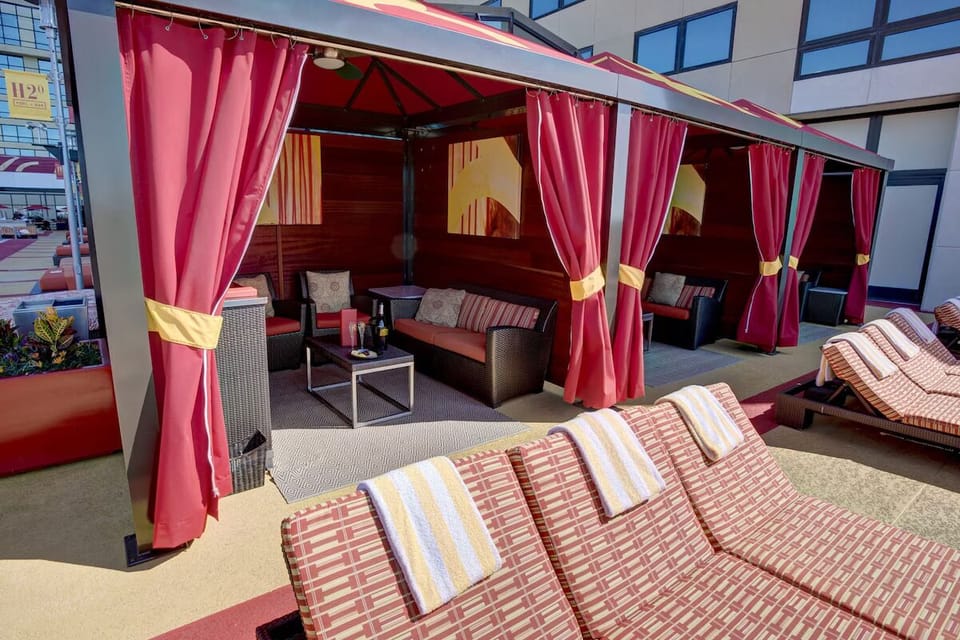 Unwind in private cabanas and lounge in breezy rooftop comfort.