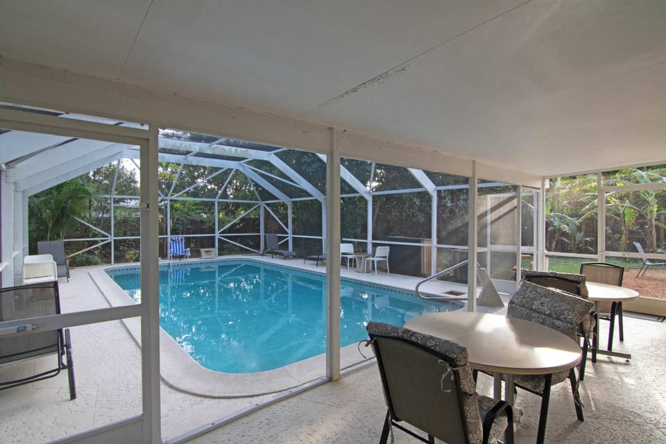 Gazebo with outdoor dining by the pool