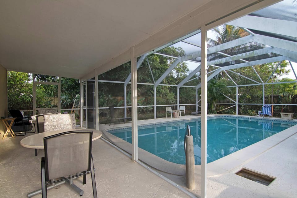 Gazebo with outdoor dining by the pool