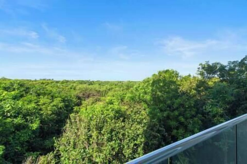 utside Bedrooms 1 & 2, enjoy serene Akumal jungle views for pure relaxation.